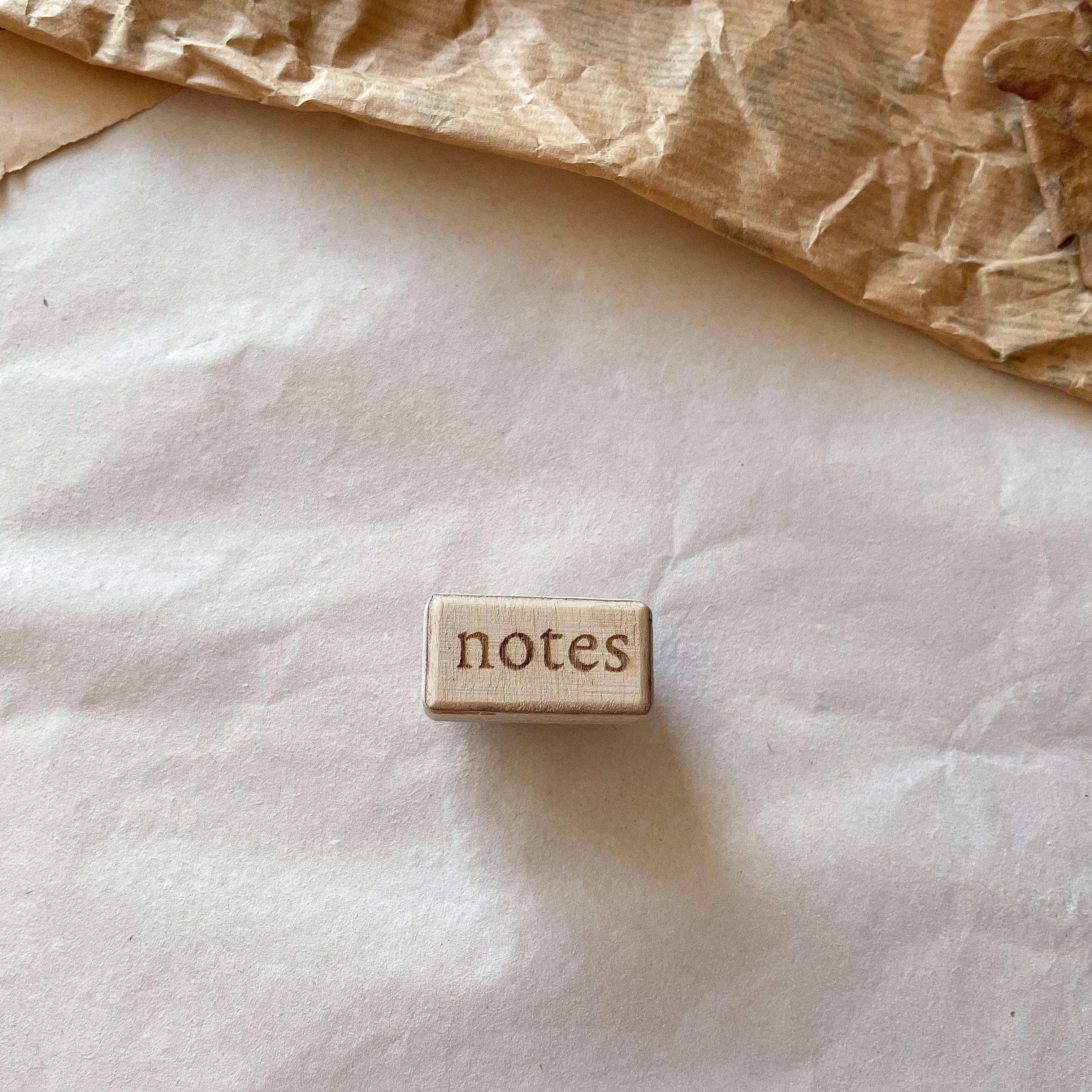 Houten stempel: "notes"