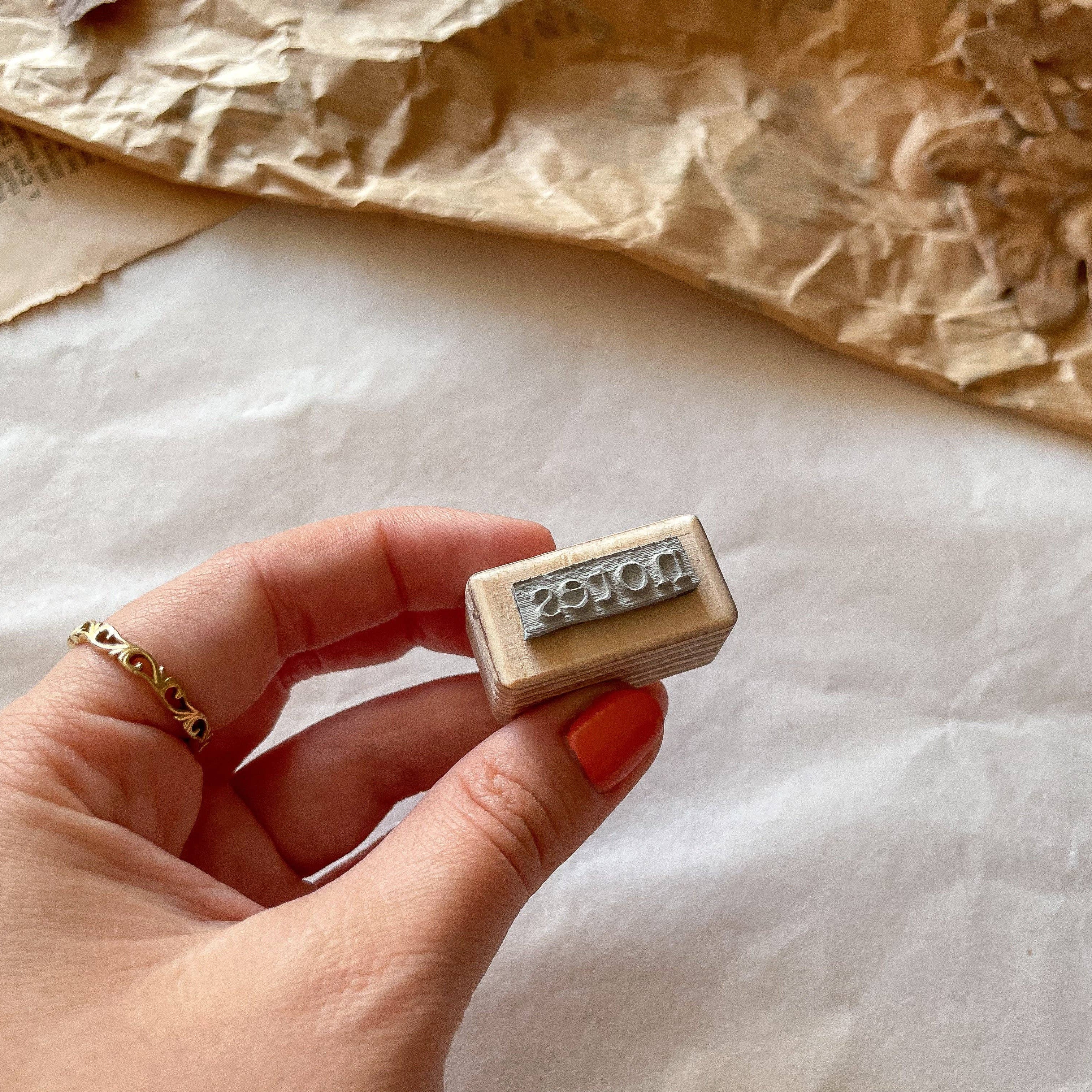 Houten stempel: "notes"